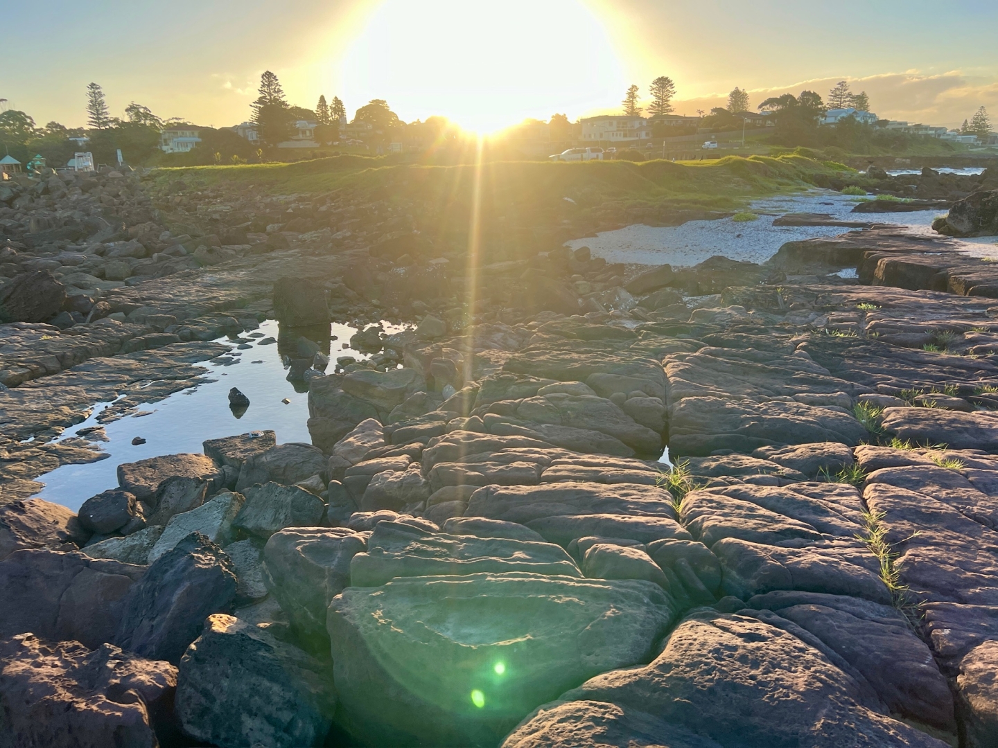 A bright setting sun .. filmed from the rock at the harbour.